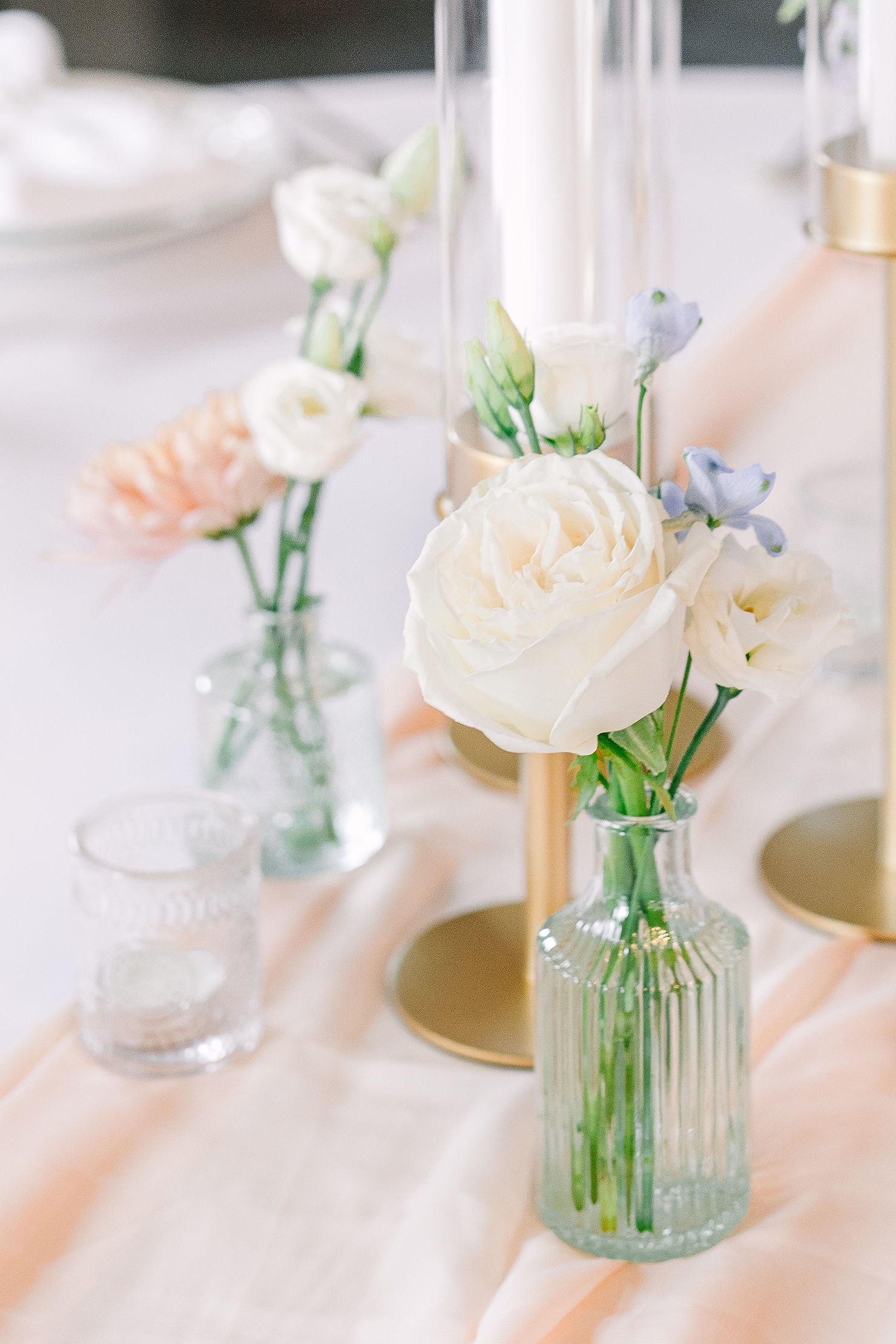 mismatched vases and wildflowers