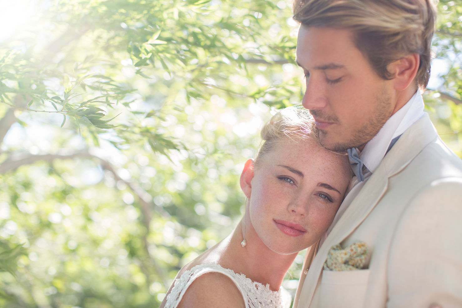 Couple embracing in the sunlight. 