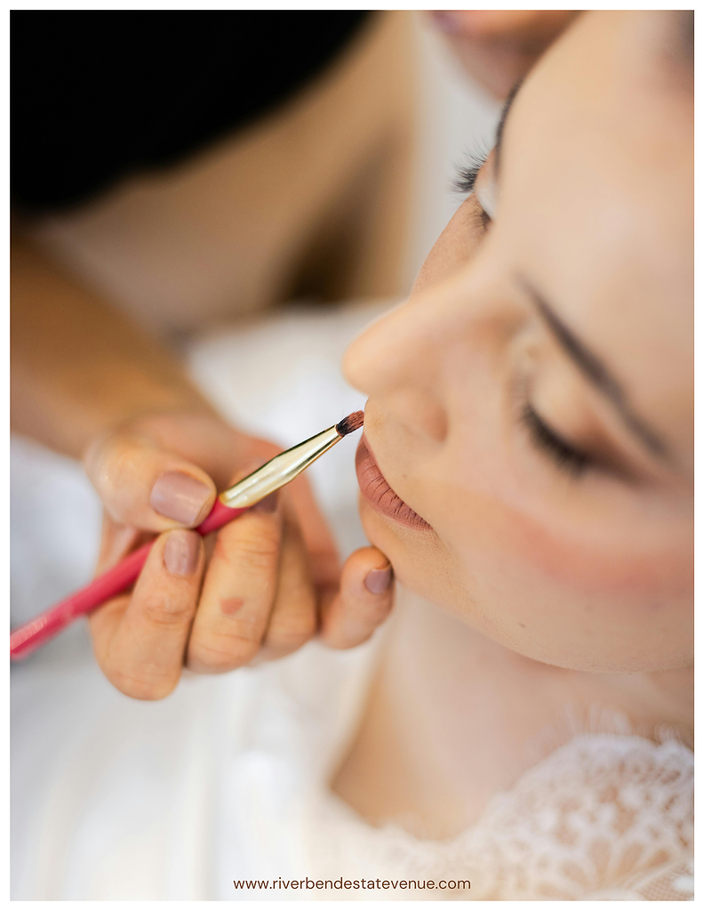 Bride getting makeup touched up.